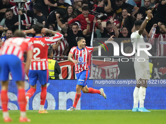 Angel Correa right winger of Atletico de Madrid and Argentina celebrates after scoring his sides first goal during the LaLiga match between...