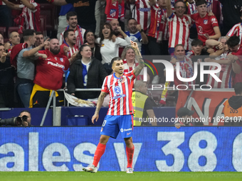 Angel Correa right winger of Atletico de Madrid and Argentina celebrates after scoring his sides first goal during the LaLiga match between...