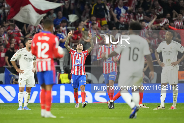 Angel Correa right winger of Atletico de Madrid and Argentina celebrates after scoring his sides first goal during the LaLiga match between...