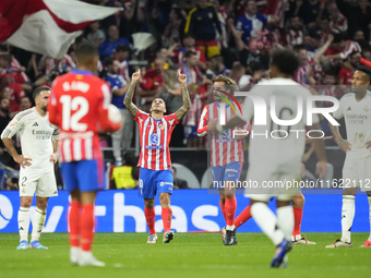 Angel Correa right winger of Atletico de Madrid and Argentina celebrates after scoring his sides first goal during the LaLiga match between...