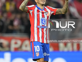 Angel Correa right winger of Atletico de Madrid and Argentina celebrates after scoring his sides first goal during the LaLiga match between...