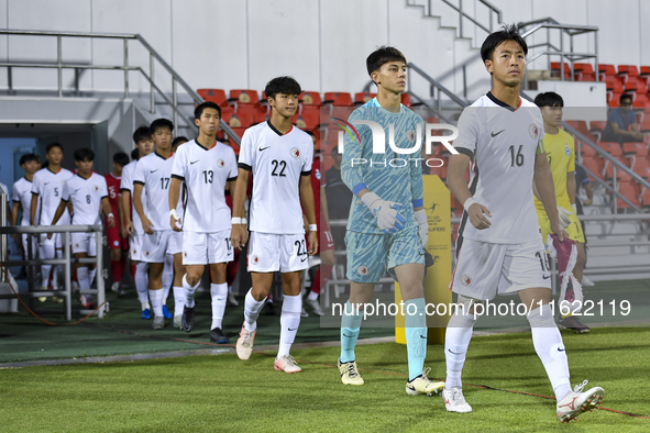 Hong Kong, China, and Singapore players walk onto the pitch before the 2025 AFC U20 Asian Cup Qualifiers Group J match between Singapore and...