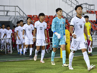 Hong Kong, China, and Singapore players walk onto the pitch before the 2025 AFC U20 Asian Cup Qualifiers Group J match between Singapore and...