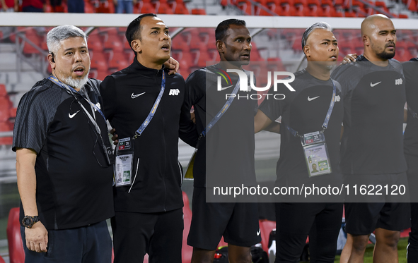 Singapore head coach Mohamed Fadzuhasny and his staff line up before the 2025 AFC U20 Asian Cup Qualifiers Group J match between Singapore a...