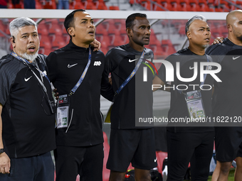 Singapore head coach Mohamed Fadzuhasny and his staff line up before the 2025 AFC U20 Asian Cup Qualifiers Group J match between Singapore a...