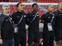 Singapore head coach Mohamed Fadzuhasny and his staff line up before the 2025 AFC U20 Asian Cup Qualifiers Group J match between Singapore a...