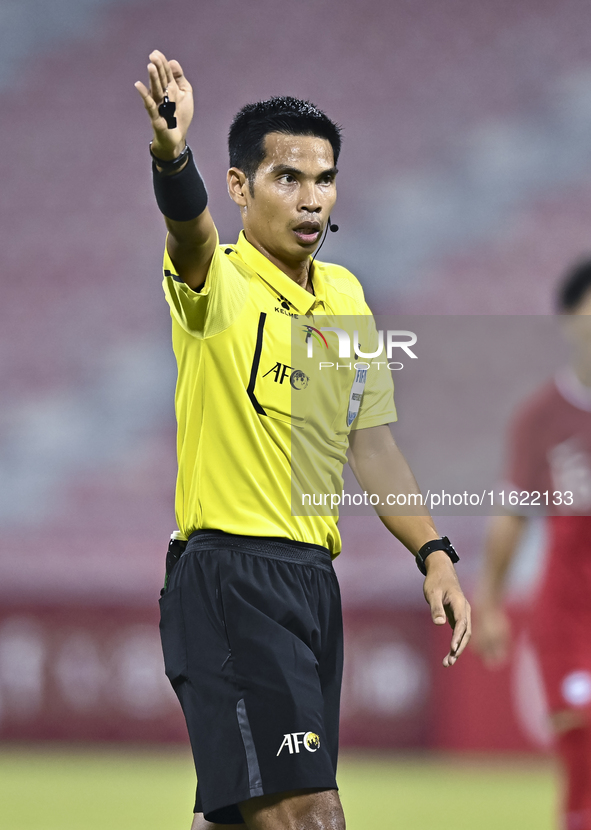 Referee Wiwat Jumpaoon of Thailand gestures during the 2025 AFC U20 Asian Cup Qualifiers Group J match between Singapore and Hong Kong, Chin...