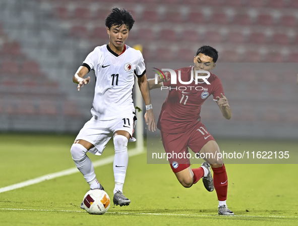 Fairuz Fazli (R) of Singapore battles for the ball with Ho Tung Lam (L) of Hong Kong, China, during the 2025 AFC U20 Asian Cup Qualifiers Gr...