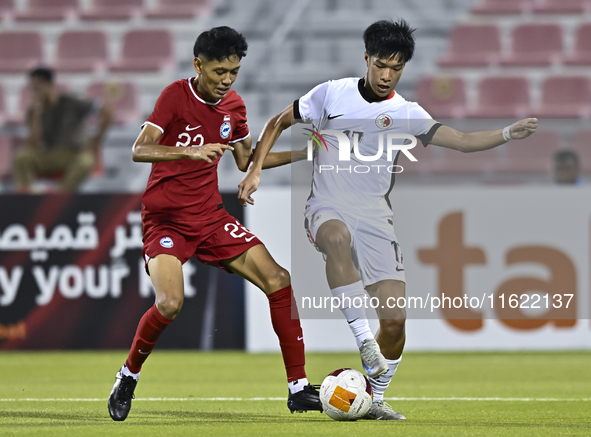 Muhammad Hud Bin Muhammad Ismail (L) of Singapore battles for the ball with Lam Ho Hei (R) of Hong Kong, China, during the 2025 AFC U20 Asia...