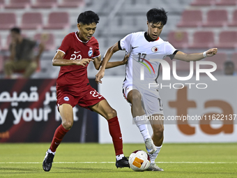 Muhammad Hud Bin Muhammad Ismail (L) of Singapore battles for the ball with Lam Ho Hei (R) of Hong Kong, China, during the 2025 AFC U20 Asia...