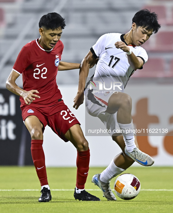 Muhammad Hud Bin Muhammad Ismail (L) of Singapore battles for the ball with Lam Ho Hei (R) of Hong Kong, China, during the 2025 AFC U20 Asia...