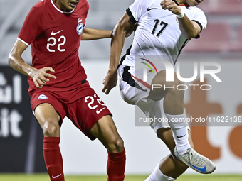 Muhammad Hud Bin Muhammad Ismail (L) of Singapore battles for the ball with Lam Ho Hei (R) of Hong Kong, China, during the 2025 AFC U20 Asia...