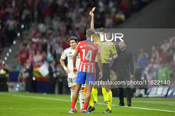 Referee Mateo Busquets Ferrer  show red card to Marcos Llorente central midfield of Atletico de Madrid and Spain during the LaLiga match bet...