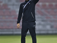 Mohamed Fadzuhasny, Head Coach of Singapore, reacts during the 2025 AFC U20 Asian Cup Qualifiers Group J match between Singapore and Hong Ko...