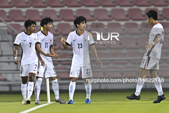 Anthony Pinto (L) of Hong Kong, China, celebrates after scoring the opening goal during the 2025 AFC U20 Asian Cup Qualifiers Group J match...