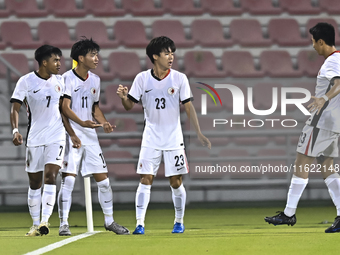 Anthony Pinto (L) of Hong Kong, China, celebrates after scoring the opening goal during the 2025 AFC U20 Asian Cup Qualifiers Group J match...