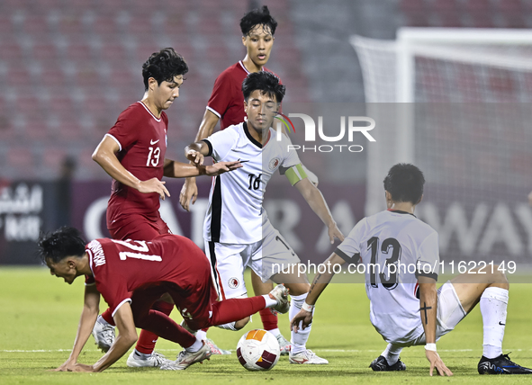 Tan-Vaissiere Louka of Singapore battles for the ball with Chan Kwan Ching Osmond of Hong Kong, China, during the 2025 AFC U20 Asian Cup Qua...