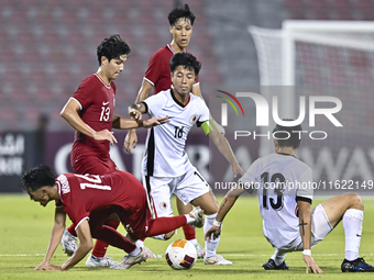 Tan-Vaissiere Louka of Singapore battles for the ball with Chan Kwan Ching Osmond of Hong Kong, China, during the 2025 AFC U20 Asian Cup Qua...