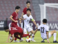 Tan-Vaissiere Louka of Singapore battles for the ball with Chan Kwan Ching Osmond of Hong Kong, China, during the 2025 AFC U20 Asian Cup Qua...