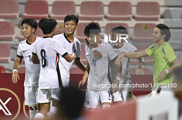 Ho Tung Lam (C) of Hong Kong, China, celebrates after scoring the second goal during the 2025 AFC U20 Asian Cup Qualifiers Group J match bet...