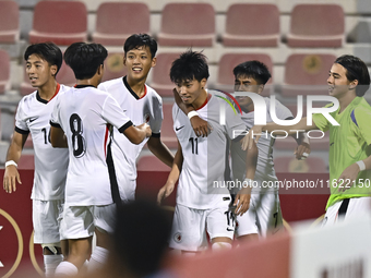 Ho Tung Lam (C) of Hong Kong, China, celebrates after scoring the second goal during the 2025 AFC U20 Asian Cup Qualifiers Group J match bet...