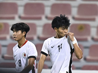 Ho Tung Lam (R) of Hong Kong, China, celebrates after scoring the second goal during the 2025 AFC U20 Asian Cup Qualifiers Group J match bet...