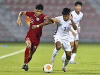 Muhammad Hud Bin Muhammad Ismail (L) of Singapore battles for the ball with Anthony Francis Pinto (R) of Hong Kong, China, during the 2025 A...