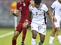 Muhammad Hud Bin Muhammad Ismail (L) of Singapore battles for the ball with Anthony Francis Pinto (R) of Hong Kong, China, during the 2025 A...