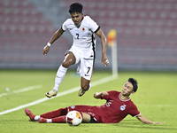 Lim Zheng Wu (bottom) of Singapore battles for the ball with Anthony Francis Pinto (left) of Hong Kong, China, during the 2025 AFC U20 Asian...