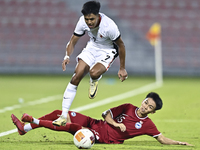 Lim Zheng Wu (bottom) of Singapore battles for the ball with Anthony Francis Pinto (left) of Hong Kong, China, during the 2025 AFC U20 Asian...