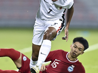 Lim Zheng Wu (bottom) of Singapore battles for the ball with Anthony Francis Pinto (left) of Hong Kong, China, during the 2025 AFC U20 Asian...