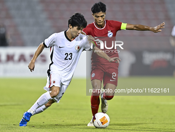 Raoul Suhaimi (R) of Singapore battles for the ball with Anthony Yeung Cheuk Kwan (L) of Hong Kong, China, during the 2025 AFC U20 Asian Cup...