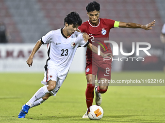 Raoul Suhaimi (R) of Singapore battles for the ball with Anthony Yeung Cheuk Kwan (L) of Hong Kong, China, during the 2025 AFC U20 Asian Cup...