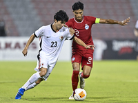 Raoul Suhaimi (R) of Singapore battles for the ball with Anthony Yeung Cheuk Kwan (L) of Hong Kong, China, during the 2025 AFC U20 Asian Cup...