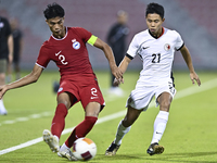 Raoul Suhaimi (L) of Singapore battles for the ball with Lee Chun Ting (R) of Hong Kong, China, during the 2025 AFC U20 Asian Cup Qualifiers...