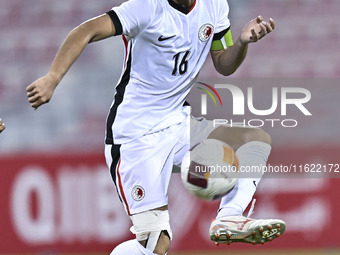 Chan Kwan Ching Osmond of Hong Kong, China, is in action during the 2025 AFC U20 Asian Cup Qualifiers Group J match between Singapore and Ho...