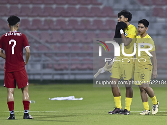 Players from Singapore express their dejection after the 2025 AFC U20 Asian Cup Qualifiers Group J match between Singapore and Hong Kong, Ch...