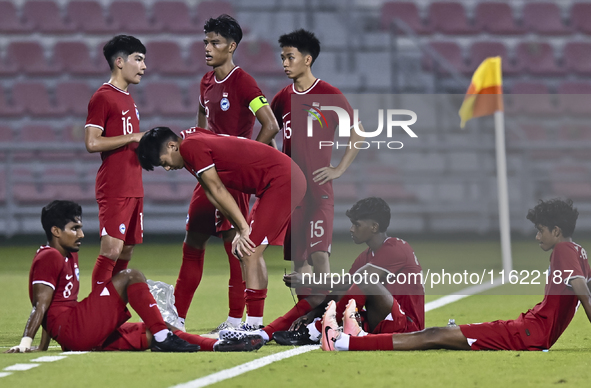 Players from Singapore express their dejection after the 2025 AFC U20 Asian Cup Qualifiers Group J match between Singapore and Hong Kong, Ch...