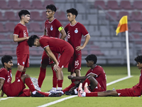 Players from Singapore express their dejection after the 2025 AFC U20 Asian Cup Qualifiers Group J match between Singapore and Hong Kong, Ch...