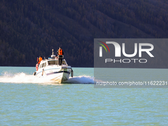 Police patrol Kanas Lake by boat in Altay, China, on September 29, 2024. (