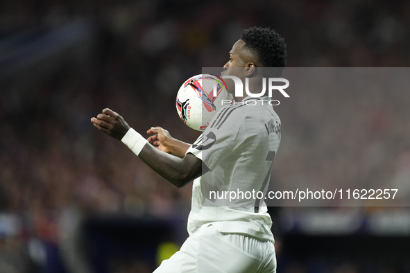 Vinicius Junior left winger of Real Madrid and Brazil controls the ball during the LaLiga match between Atletico de Madrid and Real Madrid C...