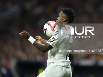 Vinicius Junior left winger of Real Madrid and Brazil controls the ball during the LaLiga match between Atletico de Madrid and Real Madrid C...