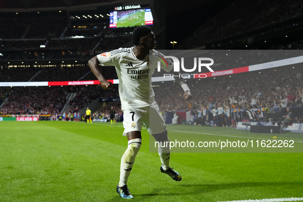 Vinicius Junior left winger of Real Madrid and Brazil celebrates the goal of his team during the LaLiga match between Atletico de Madrid and...