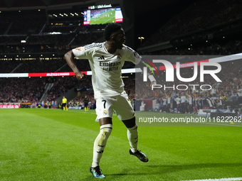 Vinicius Junior left winger of Real Madrid and Brazil celebrates the goal of his team during the LaLiga match between Atletico de Madrid and...