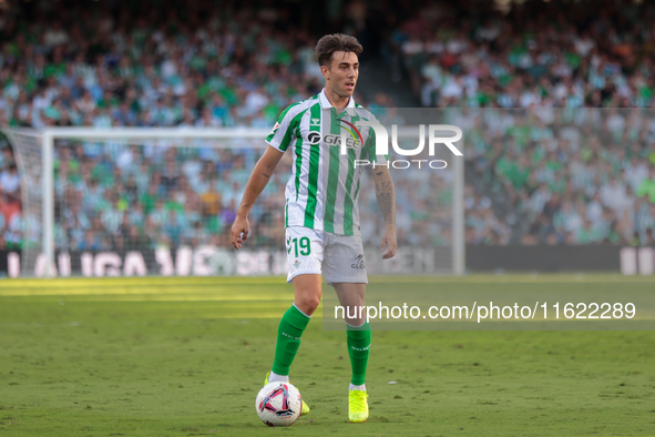 Iker Losada of Real Betis runs with the ball during the La Liga EA Sports match between Real Betis and RCD Espanyol at Benito Villamarin in...