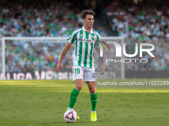 Iker Losada of Real Betis runs with the ball during the La Liga EA Sports match between Real Betis and RCD Espanyol at Benito Villamarin in...