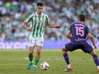 Marc Roca of Real Betis controls the ball during the La Liga EA Sports match between Real Betis and RCD Espanyol at Benito Villamarin in Sev...