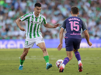 Marc Roca of Real Betis passes the ball during the La Liga EA Sports match between Real Betis and RCD Espanyol at Benito Villamarin in Sevil...