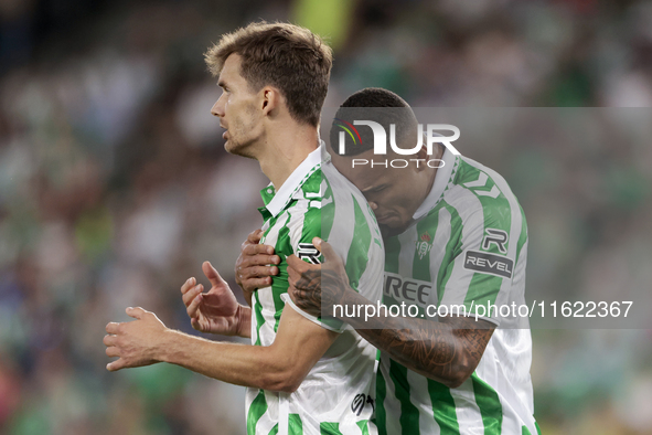 Natan Bernardo de Souza of Real Betis and Diego Llorente of Real Betis celebrate winning during the La Liga EA Sports match between Real Bet...