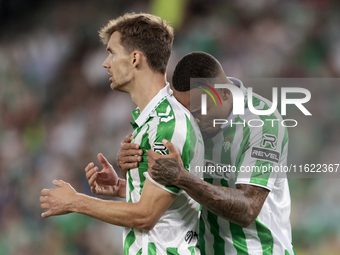 Natan Bernardo de Souza of Real Betis and Diego Llorente of Real Betis celebrate winning during the La Liga EA Sports match between Real Bet...